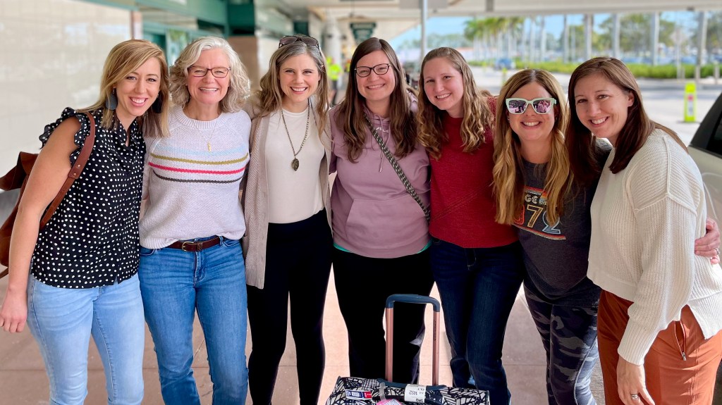 The Daughter First team at an airport
