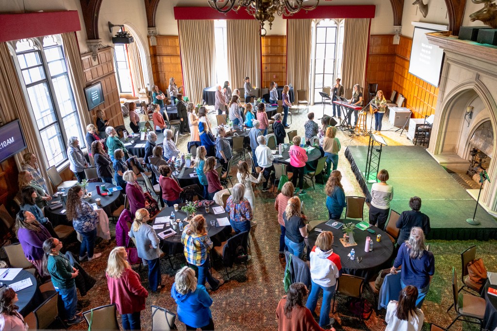 Worship in the Great Hall at Glen Eyrie Castle for the Daughters First Retreat. Photo by Marnie Hammar.
